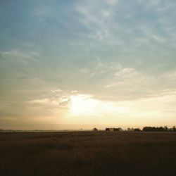 Scenic view of landscape against cloudy sky