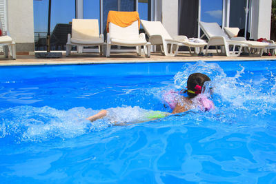 Man swimming in pool