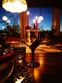 Close-up of wine glasses on table