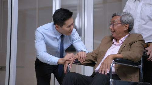 Men sitting in office