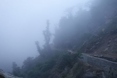 Scenic view of mountains in foggy weather