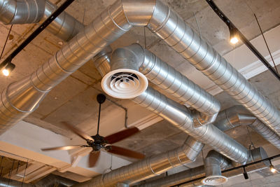 Low angle view of light bulbs hanging from ceiling