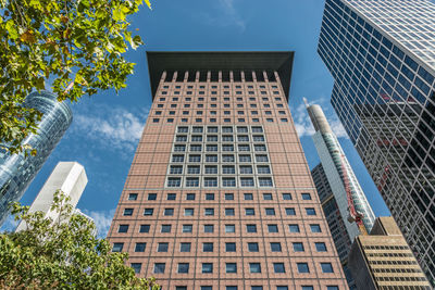 Low angle view of modern buildings against sky