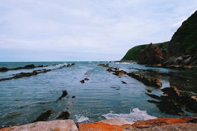 Scenic view of sea against cloudy sky