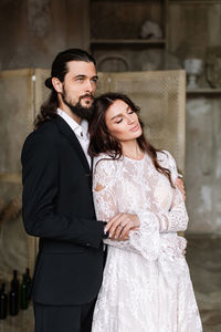 Newly wed couple standing outdoors