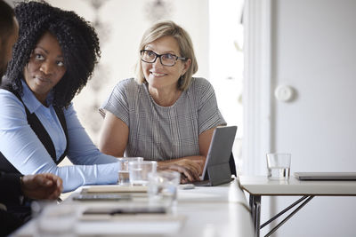 Smiling businesswoman at meeting