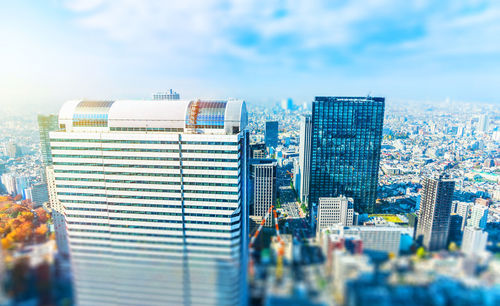 Modern buildings in city against sky