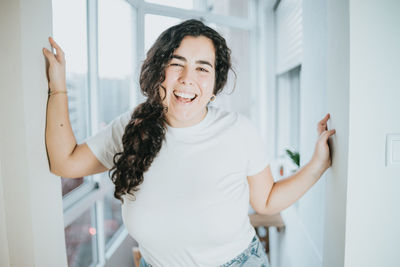 Portrait of smiling young woman at home