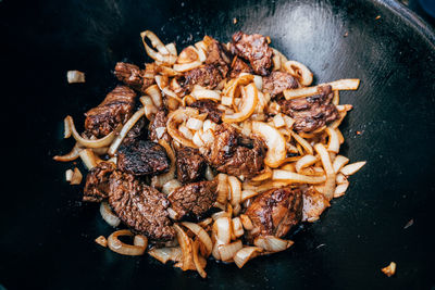 High angle view of meat on barbecue