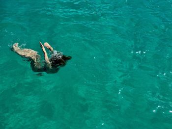 Woman swimming in sea