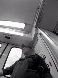 Low section of man resting against sky