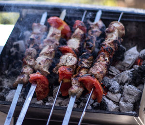 High angle view of meat on barbecue grill