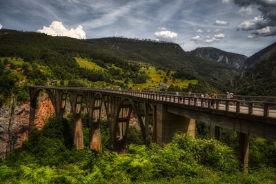 Bridge over landscape against sky