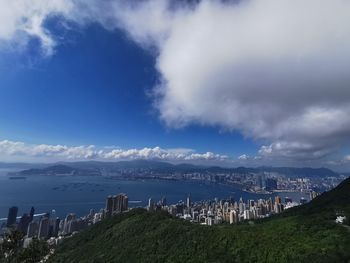 Panoramic view of sea and buildings against sky