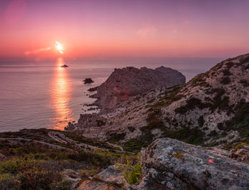 Scenic view of sea against sky during sunset