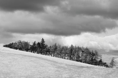 Scenic view of landscape against cloudy sky