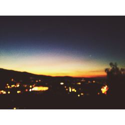 Scenic view of mountains against sky at sunset