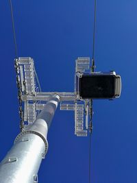 Crane against clear blue sky