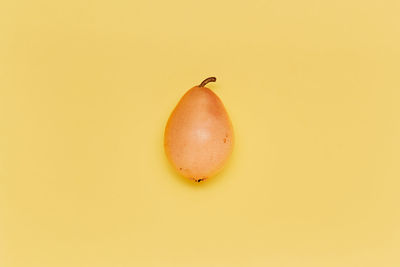 Close-up of fruit against pink background