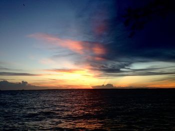 Scenic view of sea against romantic sky at sunset