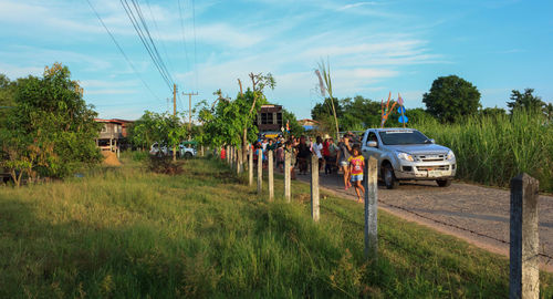 Cars on road against sky