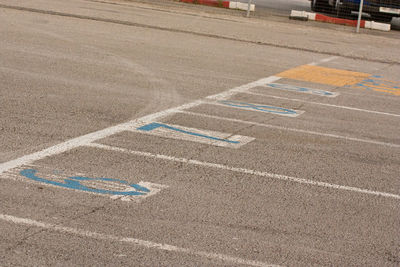 High angle view of arrow symbol on road