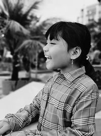 Portrait of smiling woman looking away