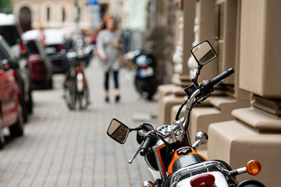 Motor cycle parked on street in city