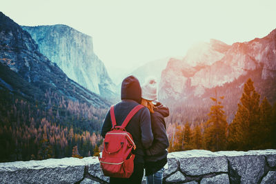 Rear view of man standing on mountain