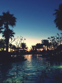 View of swimming pool at sunset