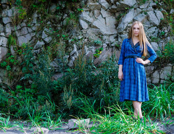 Woman standing in forest