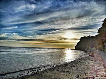 Scenic view of beach against sky during sunset