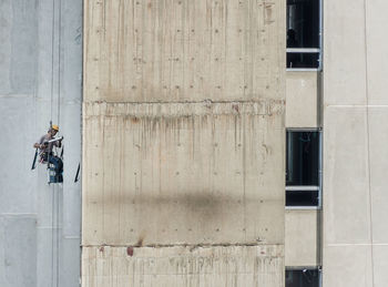 Directly above shot of people on building wall