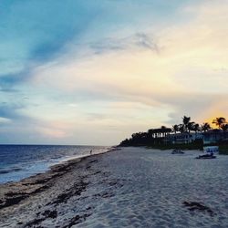 Scenic view of beach against sky during sunset