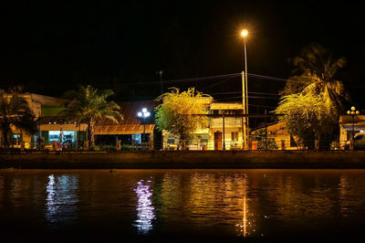 Reflection of illuminated buildings in water at night