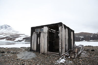 Scenic view of snow covered mountains against sky