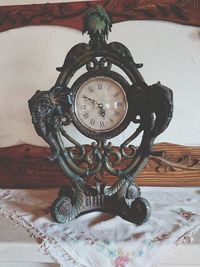 High angle view of clock on table at home