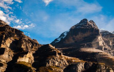 Low angle view of rock formations against sky