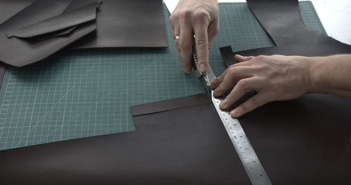 Cropped hands of man working in workshop