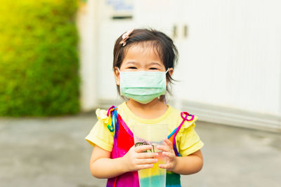 Portrait of boy standing outdoors
