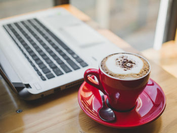 Close-up of coffee cup on table