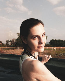 Portrait of smiling woman swimming in pool