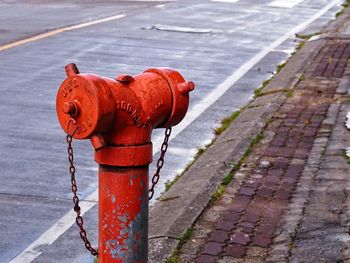 High angle view of fire hydrant on footpath