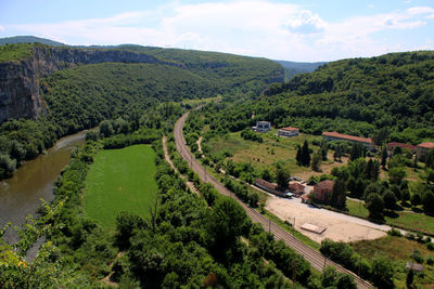 Scenic view of green landscape against sky