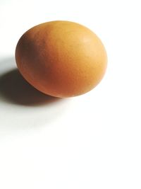 Close-up of eggs against white background