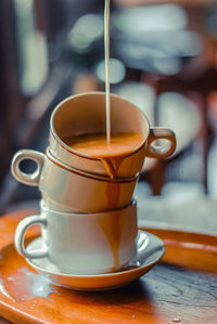 Close-up of coffee cup on table