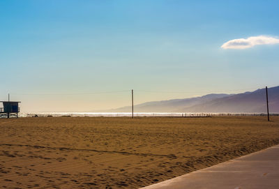 Scenic view of beach against sky during sunset