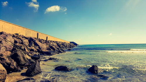 Scenic view of sea against blue sky