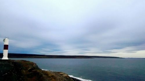 Scenic view of sea against cloudy sky