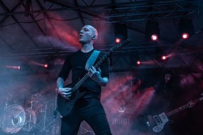 Full length of man playing guitar